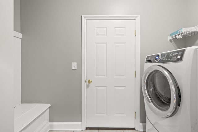 washroom with washer / dryer, baseboards, and laundry area