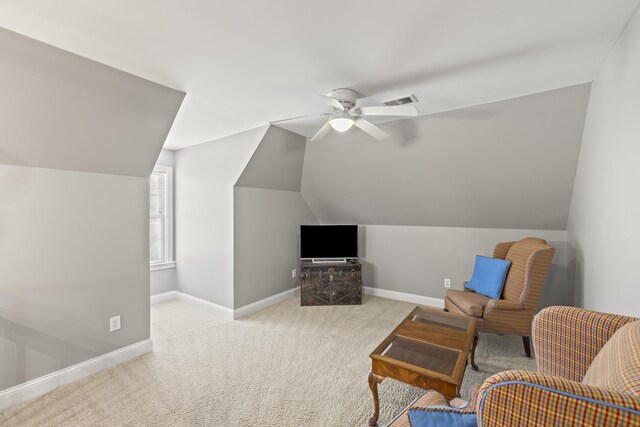 sitting room featuring ceiling fan, visible vents, baseboards, and lofted ceiling