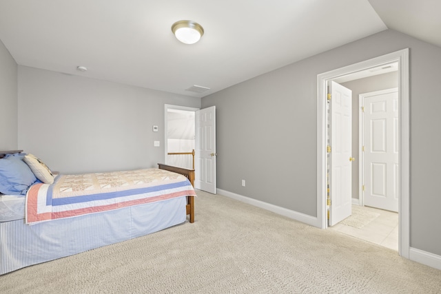 bedroom featuring baseboards and carpet