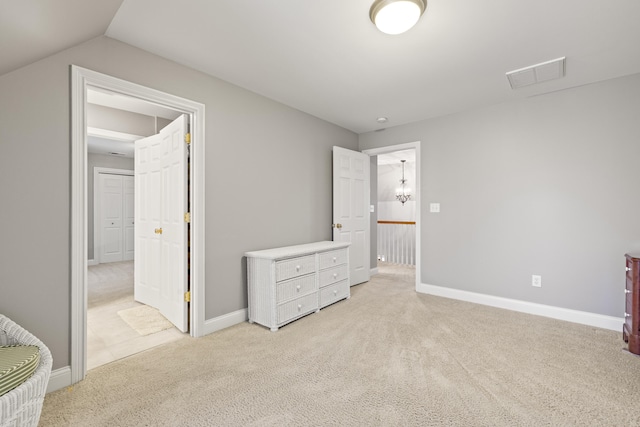 unfurnished bedroom with visible vents, carpet, and baseboards