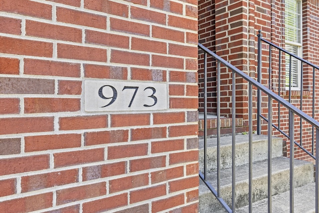 exterior details featuring brick siding
