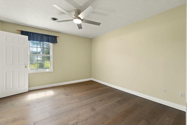 1124 Heartland Dr, Somerset, KY 42503 - spare room with ceiling fan, dark wood-style flooring, and baseboards