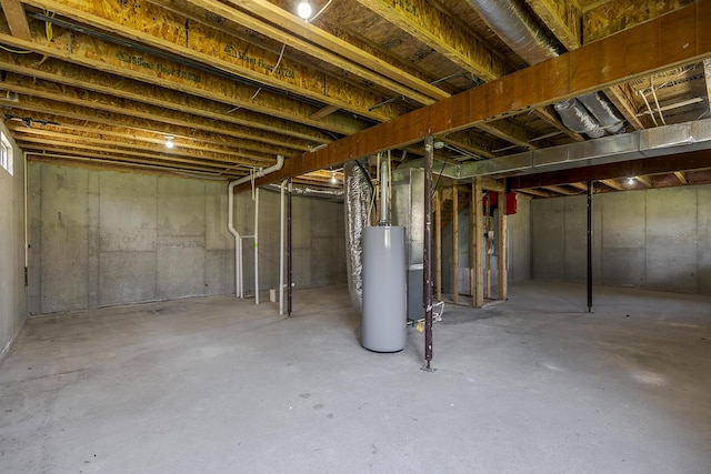 unfinished basement featuring gas water heater