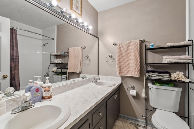 full bath featuring a sink, toilet, double vanity, and visible vents