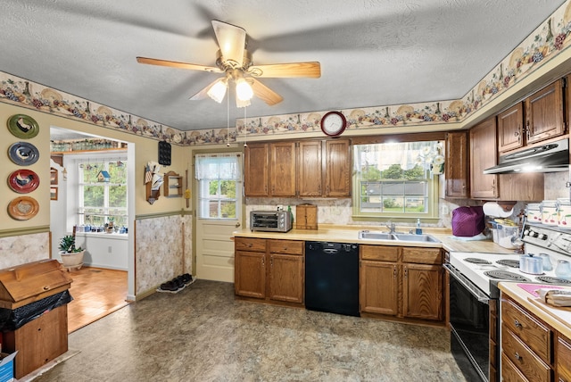 kitchen with light floors, black dishwasher, electric range oven, under cabinet range hood, and a sink