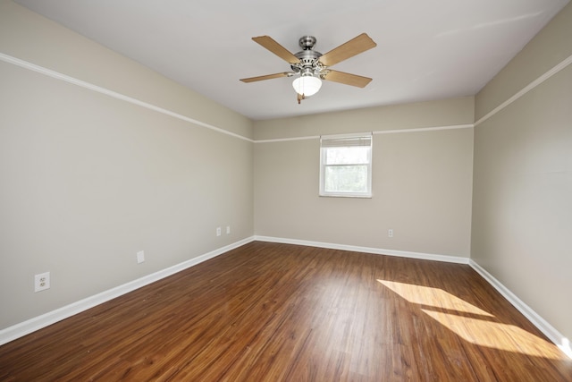 unfurnished room with baseboards, a ceiling fan, and wood finished floors