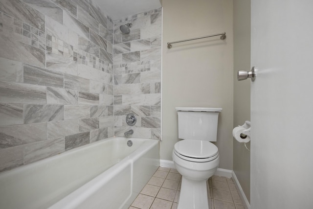 full bath featuring toilet, tile patterned flooring, baseboards, and  shower combination