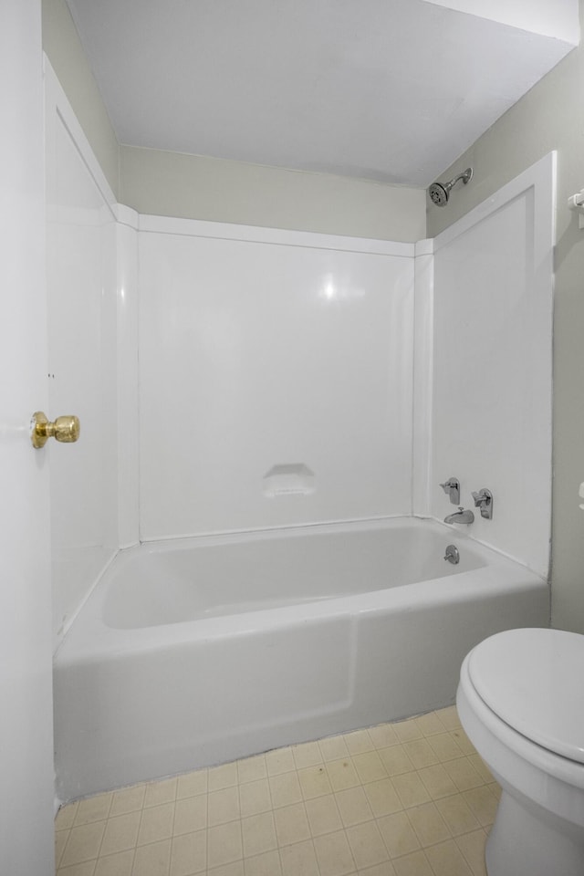 bathroom with toilet and  shower combination
