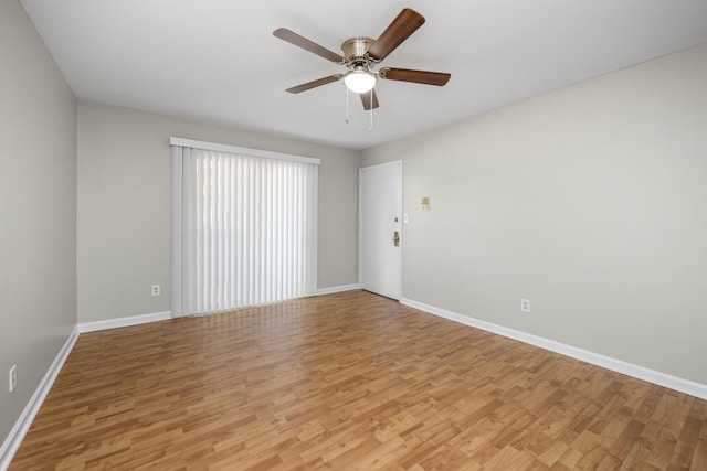 unfurnished room with light wood-style floors, baseboards, and ceiling fan