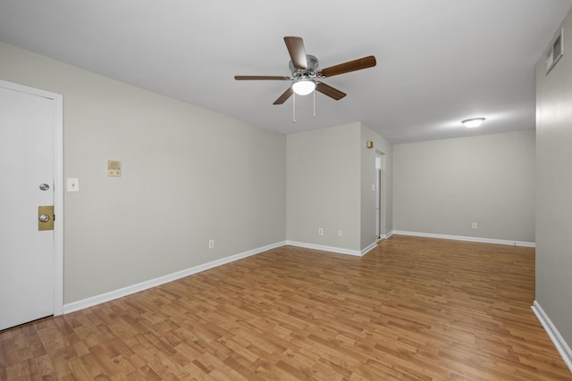 unfurnished room with light wood-style flooring, ceiling fan, and baseboards