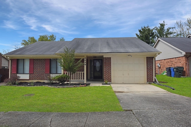single story home with a garage, a front yard, brick siding, and driveway