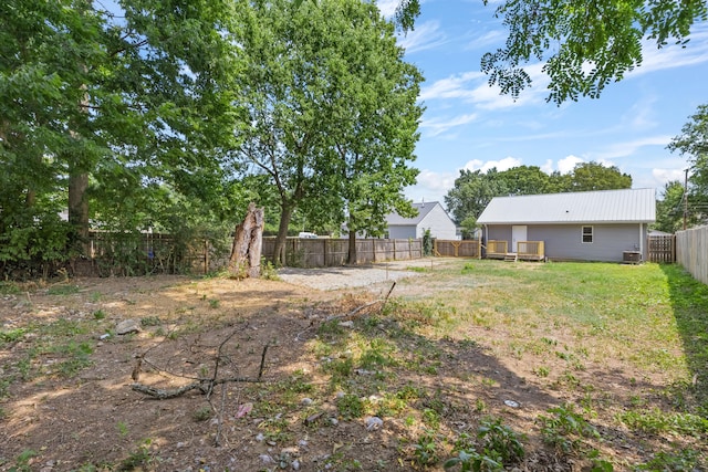 view of yard with a fenced backyard and a deck
