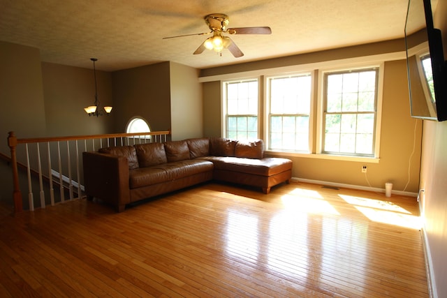 312 Springhurst Dr, Berea, KY 40403 - living area featuring baseboards, ceiling fan with notable chandelier, hardwood / wood-style floors, and visible vents
