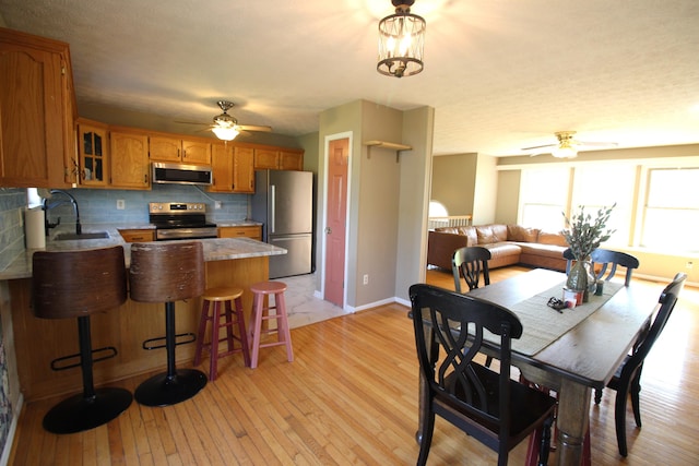 312 Springhurst Dr, Berea, KY 40403 - dining space featuring baseboards, light wood-style flooring, and ceiling fan