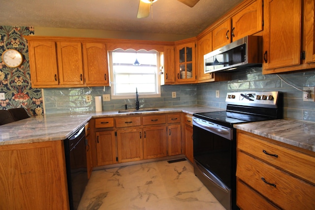312 Springhurst Dr, Berea, KY 40403 - kitchen featuring a sink, a ceiling fan, brown cabinets, and stainless steel appliances