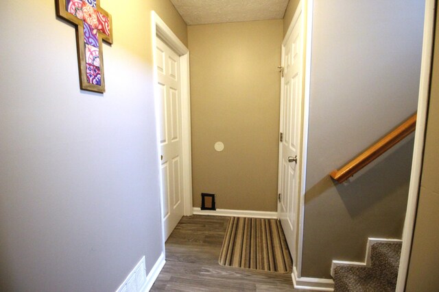 312 Springhurst Dr, Berea, KY 40403 - corridor featuring visible vents, stairs, wood finished floors, baseboards, and a textured ceiling