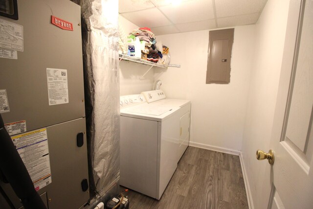 312 Springhurst Dr, Berea, KY 40403 - laundry room featuring laundry area, separate washer and dryer, heating unit, wood finished floors, and electric panel