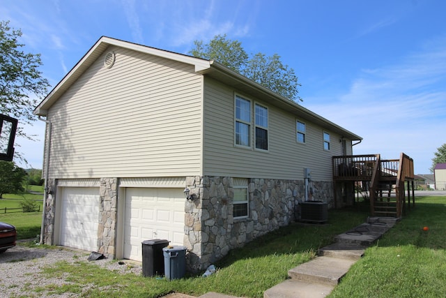 312 Springhurst Dr, Berea, KY 40403 - view of property exterior with stairs, stone siding, a garage, a deck, and a yard