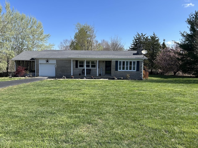 9380 Russell Springs Rd, Russell Springs, KY 42642 - ranch-style house with aphalt driveway, a front lawn, an attached garage, and covered porch