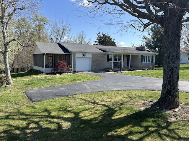 9380 Russell Springs Rd, Russell Springs, KY 42642 - view of front of house featuring fence, a front lawn, an attached garage, a chimney, and driveway