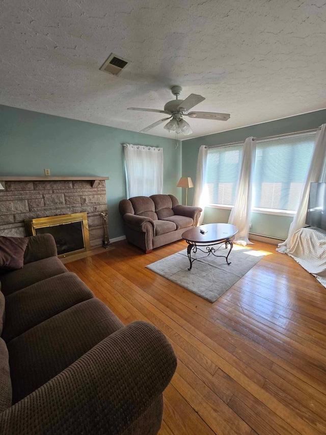9380 Russell Springs Rd, Russell Springs, KY 42642 - living room with visible vents, a textured ceiling, and a healthy amount of sunlight
