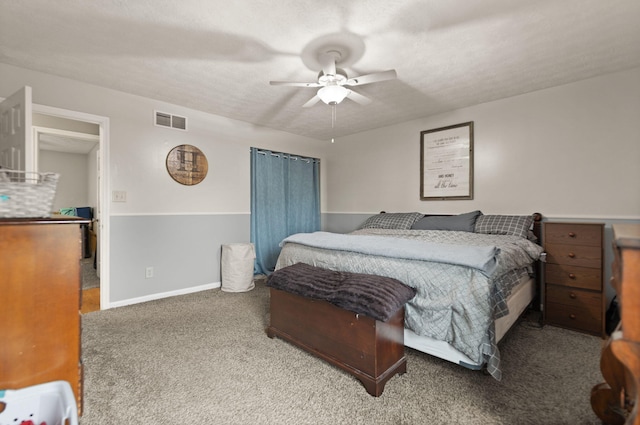 bedroom featuring visible vents, a ceiling fan, and carpet floors