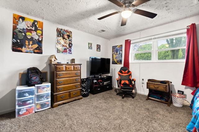 game room with visible vents, a ceiling fan, carpet, and a textured ceiling