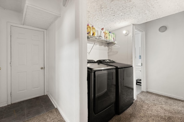 clothes washing area with laundry area, baseboards, and independent washer and dryer