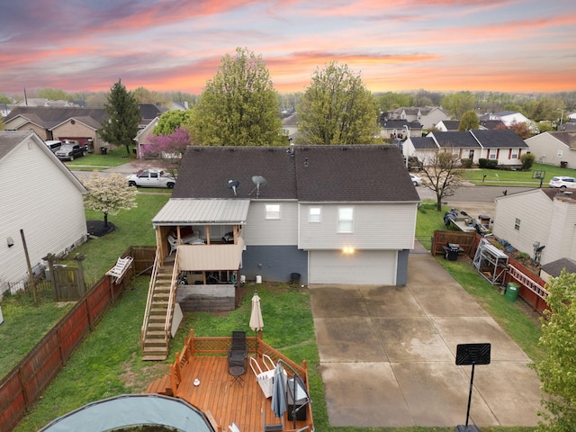 aerial view at dusk featuring a residential view