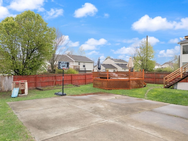view of patio with a fenced backyard, stairway, a residential view, and a deck