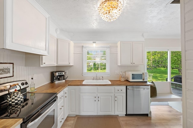 124 Clays Ferry Dr, Richmond, KY 40475 - kitchen with a sink, stainless steel appliances, crown molding, a textured ceiling, and white cabinetry