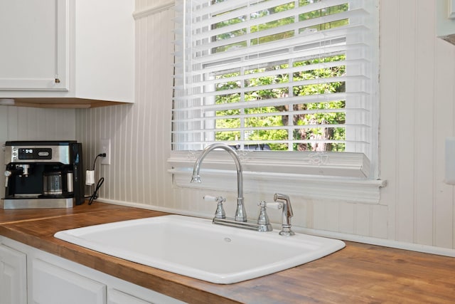 124 Clays Ferry Dr, Richmond, KY 40475 - kitchen featuring white cabinetry, baseboards, a sink, and wood finished floors