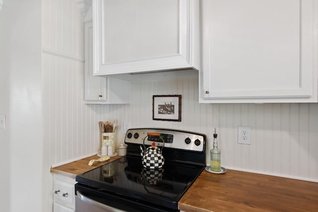 124 Clays Ferry Dr, Richmond, KY 40475 - kitchen featuring stainless steel electric range oven, wooden counters, wood finished floors, and white cabinetry
