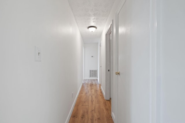 124 Clays Ferry Dr, Richmond, KY 40475 - hall with a textured ceiling, baseboards, visible vents, and light wood-style floors