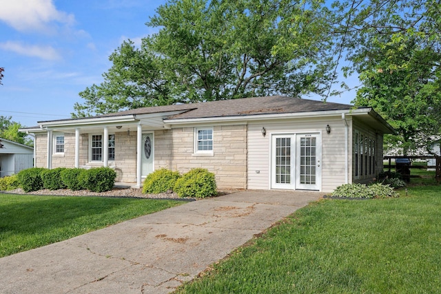 124 Clays Ferry Dr, Richmond, KY 40475 - view of front facade featuring a front yard, a shingled roof, and stone siding