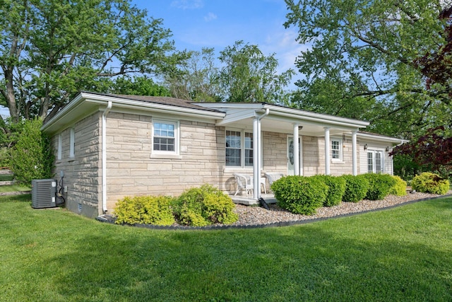 124 Clays Ferry Dr, Richmond, KY 40475 - exterior space with cooling unit, stone siding, a porch, and a front yard
