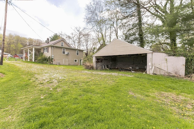 view of yard with an outbuilding and a pole building