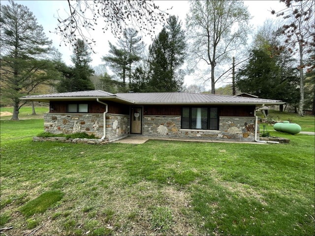 1459 Buck Lick Rd, Tollesboro, KY 41189 - view of front of home with stone siding, a front lawn, and a metal roof