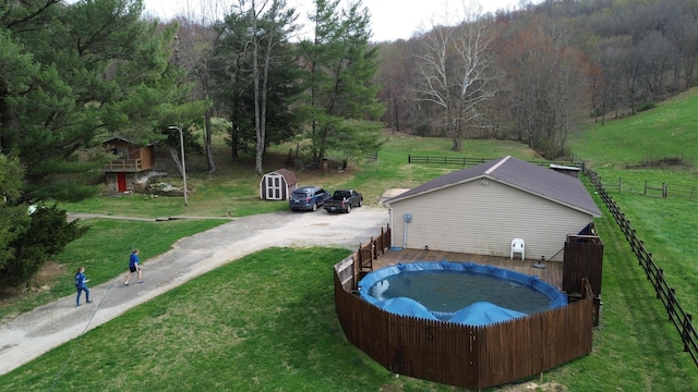 1459 Buck Lick Rd, Tollesboro, KY 41189 - view of swimming pool with a wooded view, a covered pool, and a wooden deck