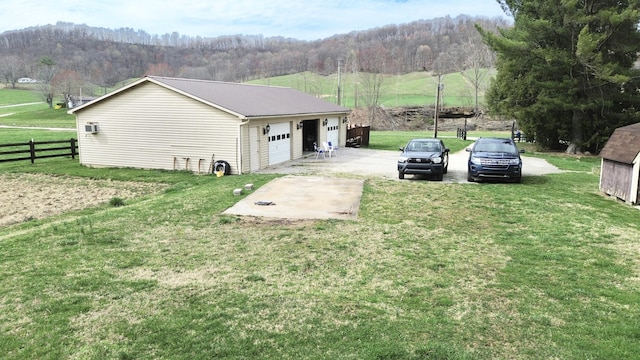 1459 Buck Lick Rd, Tollesboro, KY 41189 - view of side of property with a garage and a forest view