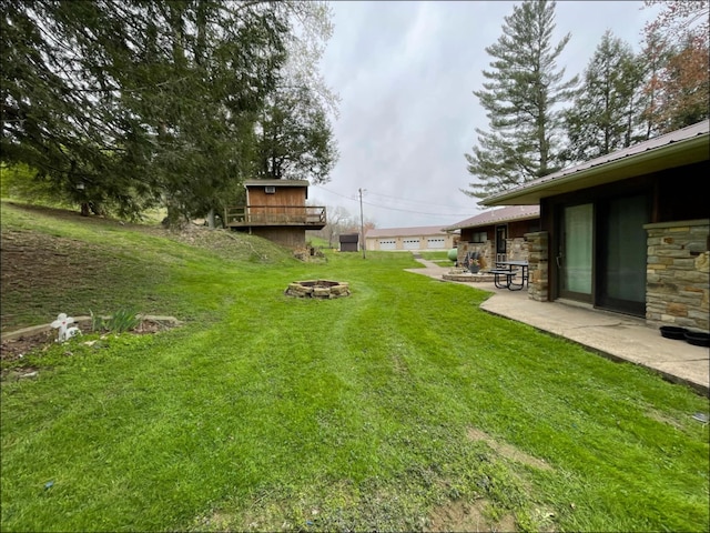1459 Buck Lick Rd, Tollesboro, KY 41189 - view of green lawn with an outdoor fire pit and a patio