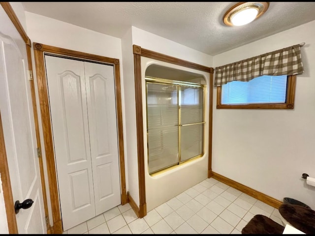 1459 Buck Lick Rd, Tollesboro, KY 41189 - full bath with shower / bath combination with glass door, tile patterned flooring, and a textured ceiling