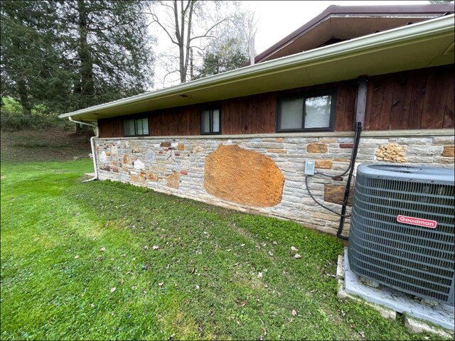 1459 Buck Lick Rd, Tollesboro, KY 41189 - view of home's exterior featuring stone siding and a yard
