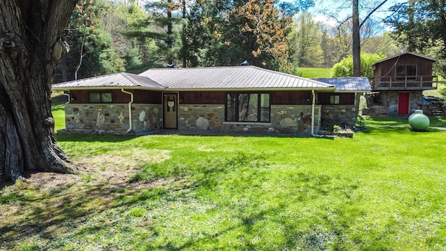 1459 Buck Lick Rd, Tollesboro, KY 41189 - view of front facade with stone siding, a front yard, and a metal roof