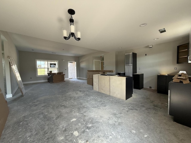 860 Denali Dr, Richmond, KY 40475 - kitchen with open floor plan, a kitchen island, a chandelier, and hanging light fixtures