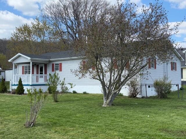 view of front of home featuring a front yard and a porch