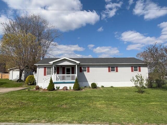 view of front of property with a porch and a front lawn