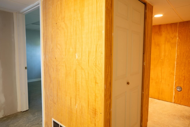 hall featuring carpet floors and visible vents