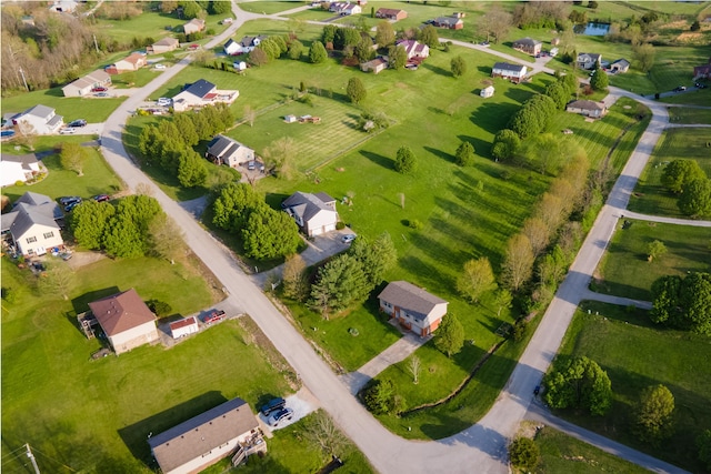 birds eye view of property with a residential view