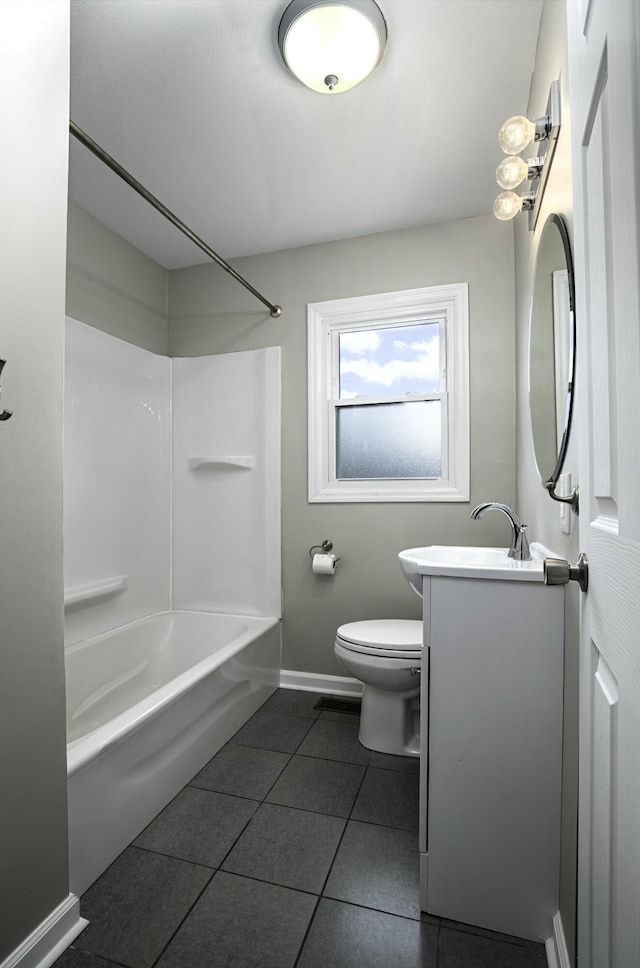full bathroom with vanity,  shower combination, toilet, tile patterned floors, and baseboards